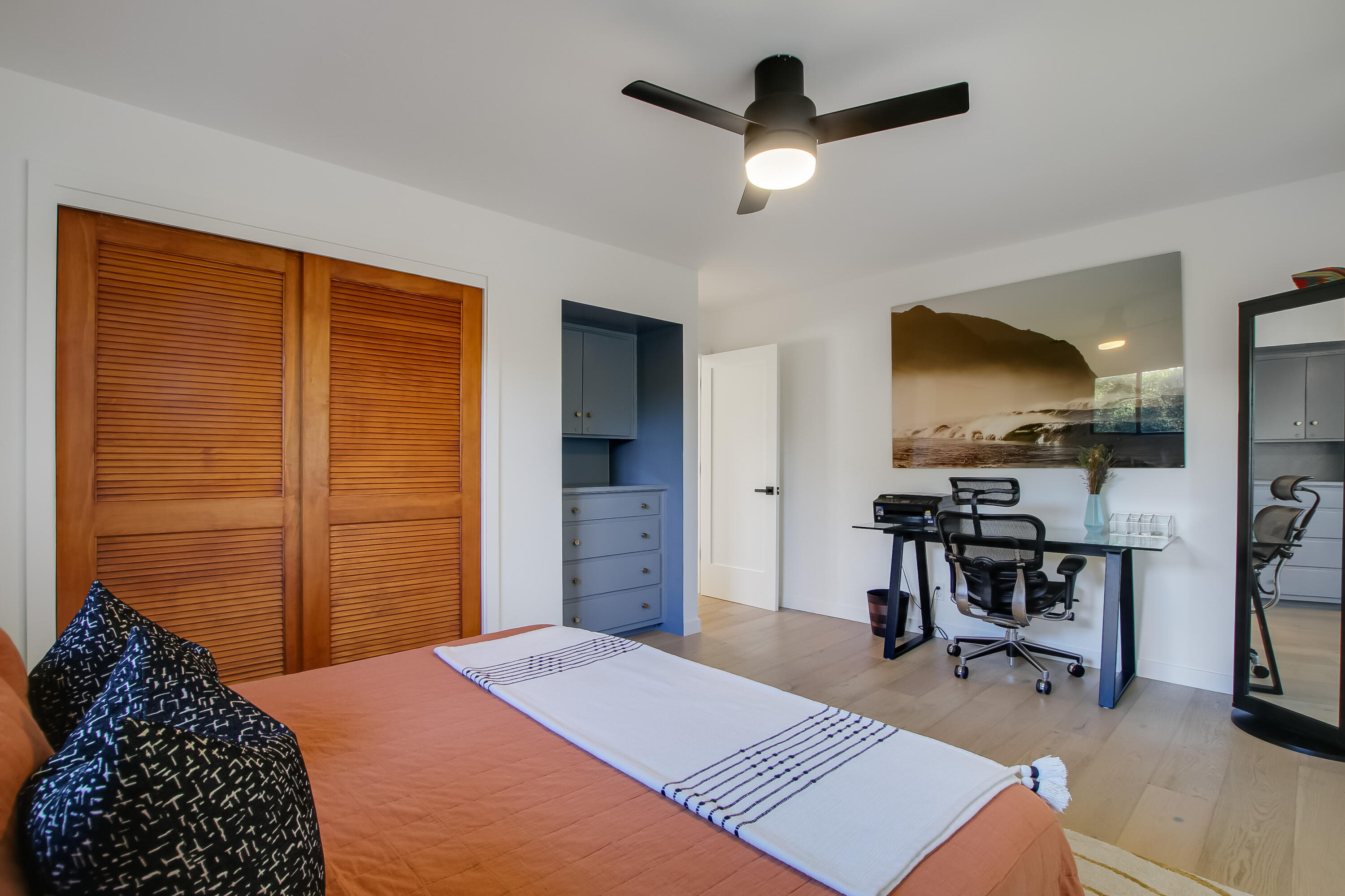 308 Cooper Road Santa Barbara, CA 93109 - Photo 26 of 41 a bedroom with a bed and a chandelier
