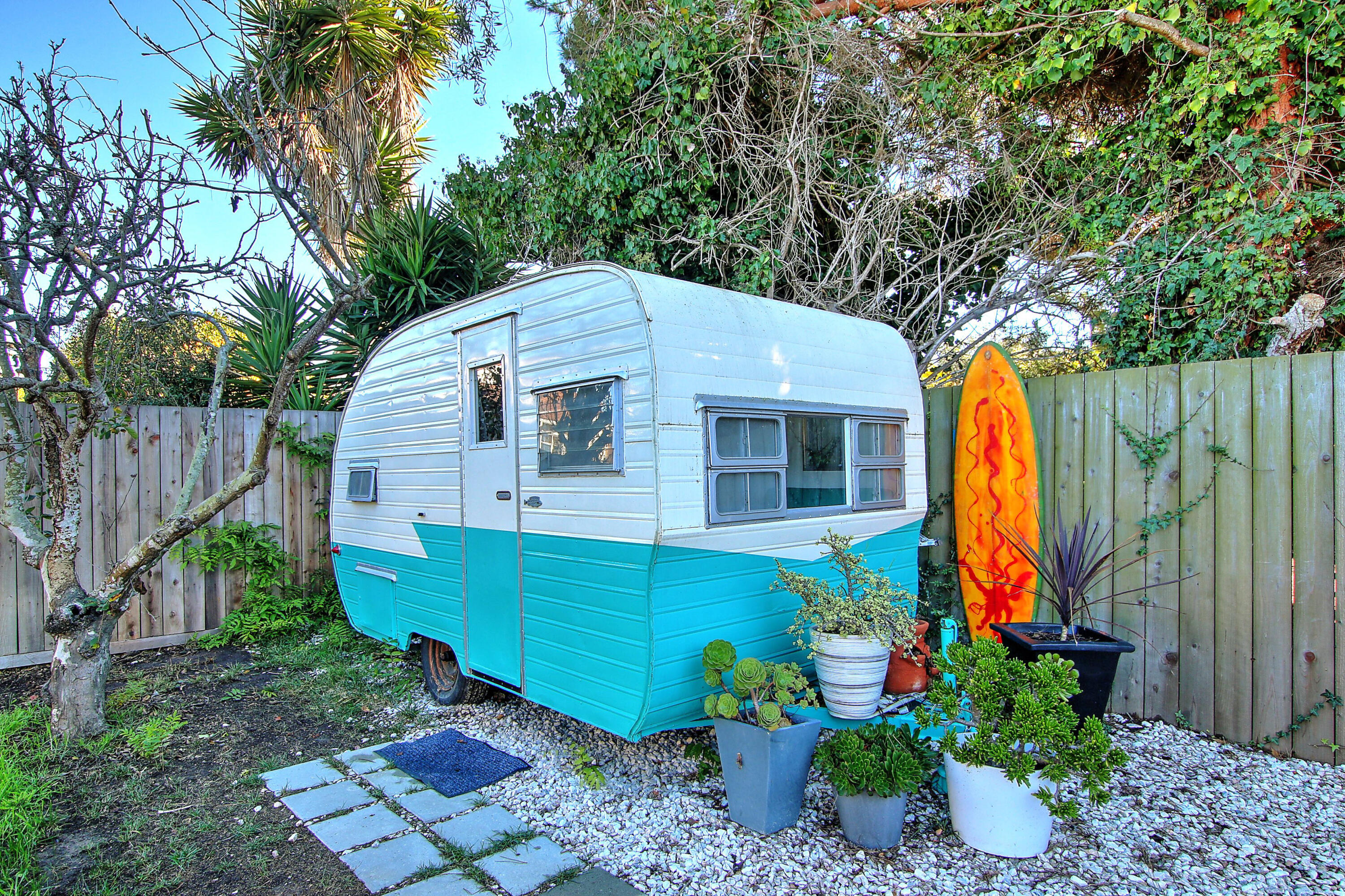 308 Cooper Road Santa Barbara, CA 93109 - Photo 38 of 41 a view of backyard with potted plants and wooden fence