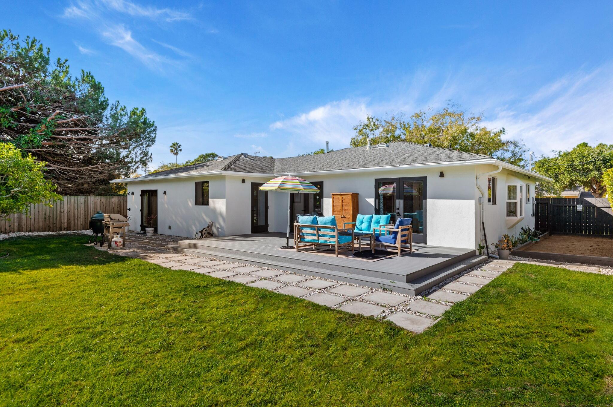 308 Cooper Road Santa Barbara, CA 93109 - Photo 5 of 41 a front view of a house with patio and garden