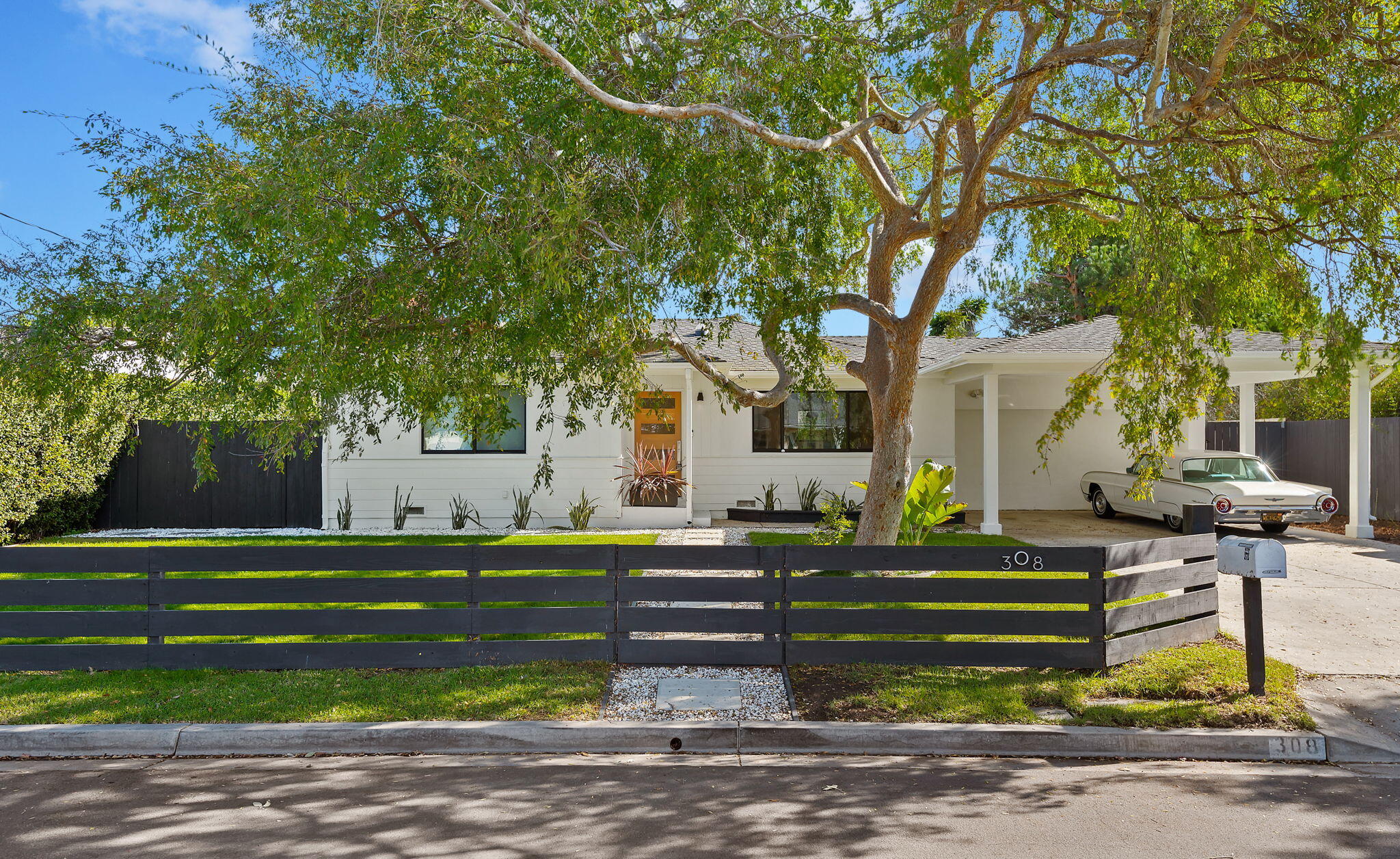 308 Cooper Road Santa Barbara, CA 93109 - Photo 10 of 41 a front view of a house with a yard