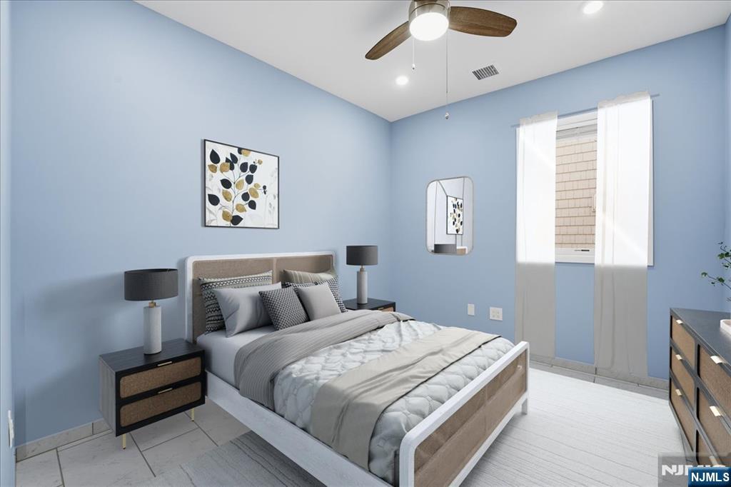 85 Beckwith Place Rutherford, NJ 07070 - Photo 18 of 49 a bedroom with bed and window