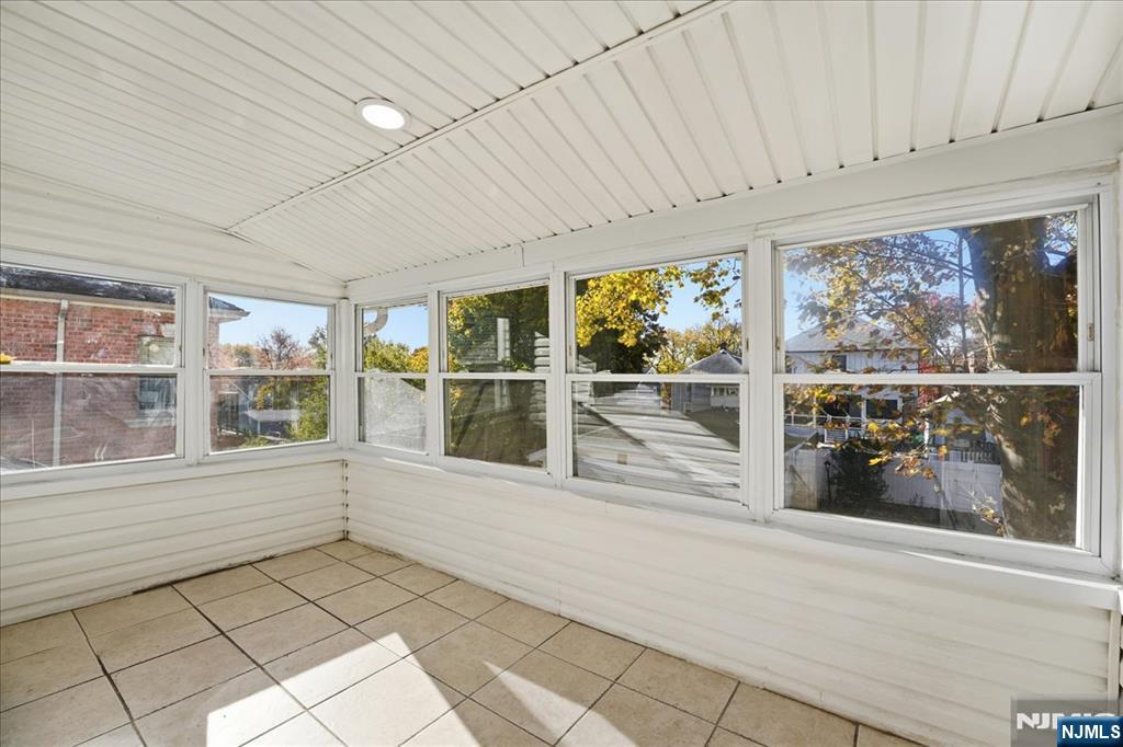 85 Beckwith Place Rutherford, NJ 07070 - Photo 23 of 49 a view of an empty room with a window