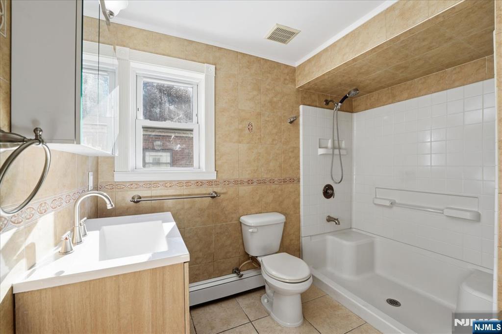 85 Beckwith Place Rutherford, NJ 07070 - Photo 25 of 49 a bathroom with a sink toilet and shower