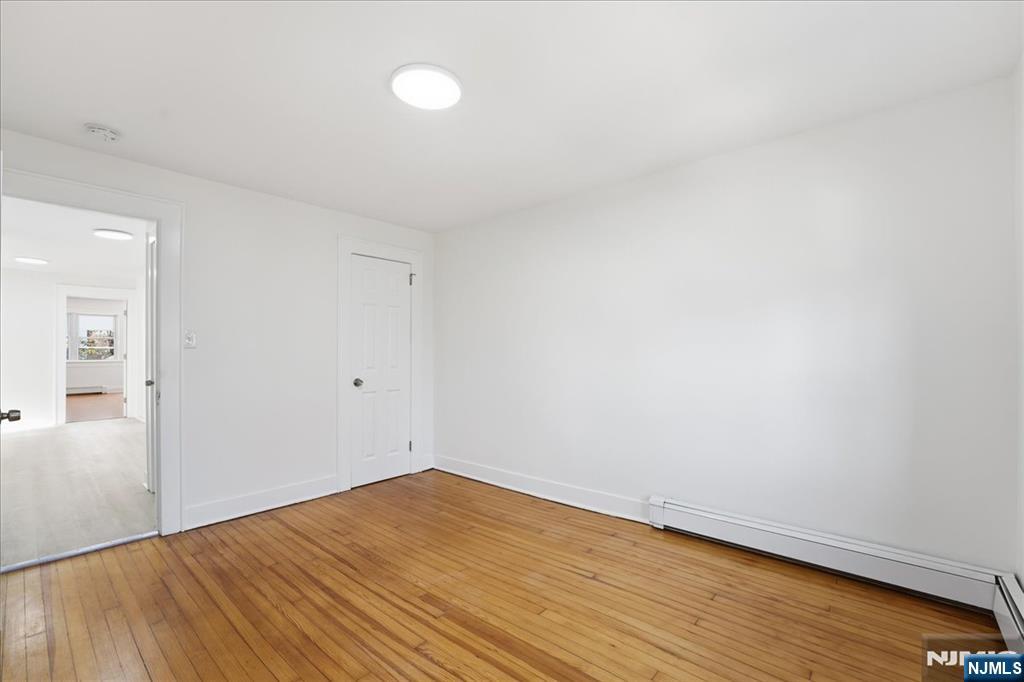 85 Beckwith Place Rutherford, NJ 07070 - Photo 28 of 49 a view of empty room with wooden floor