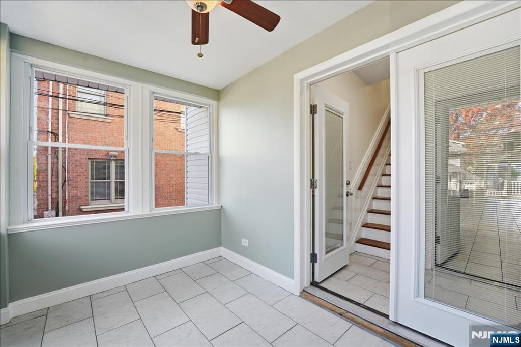 85 Beckwith Place Rutherford, NJ 07070 - Photo 4 of 49 an empty room with windows