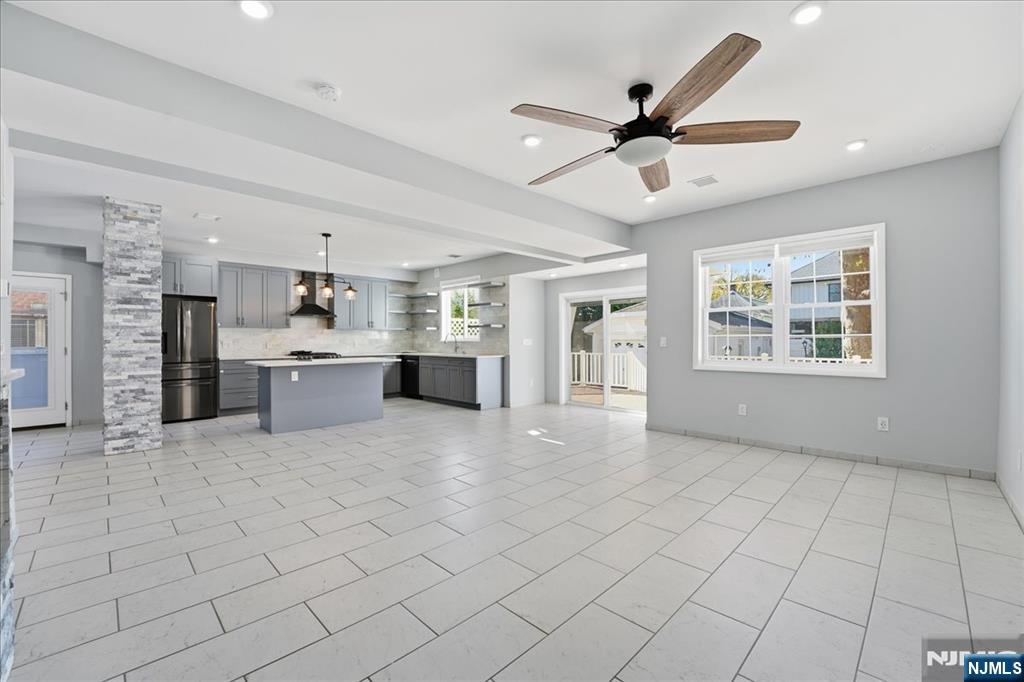 85 Beckwith Place Rutherford, NJ 07070 - Photo 8 of 49 a view of an empty room with window and cabinet