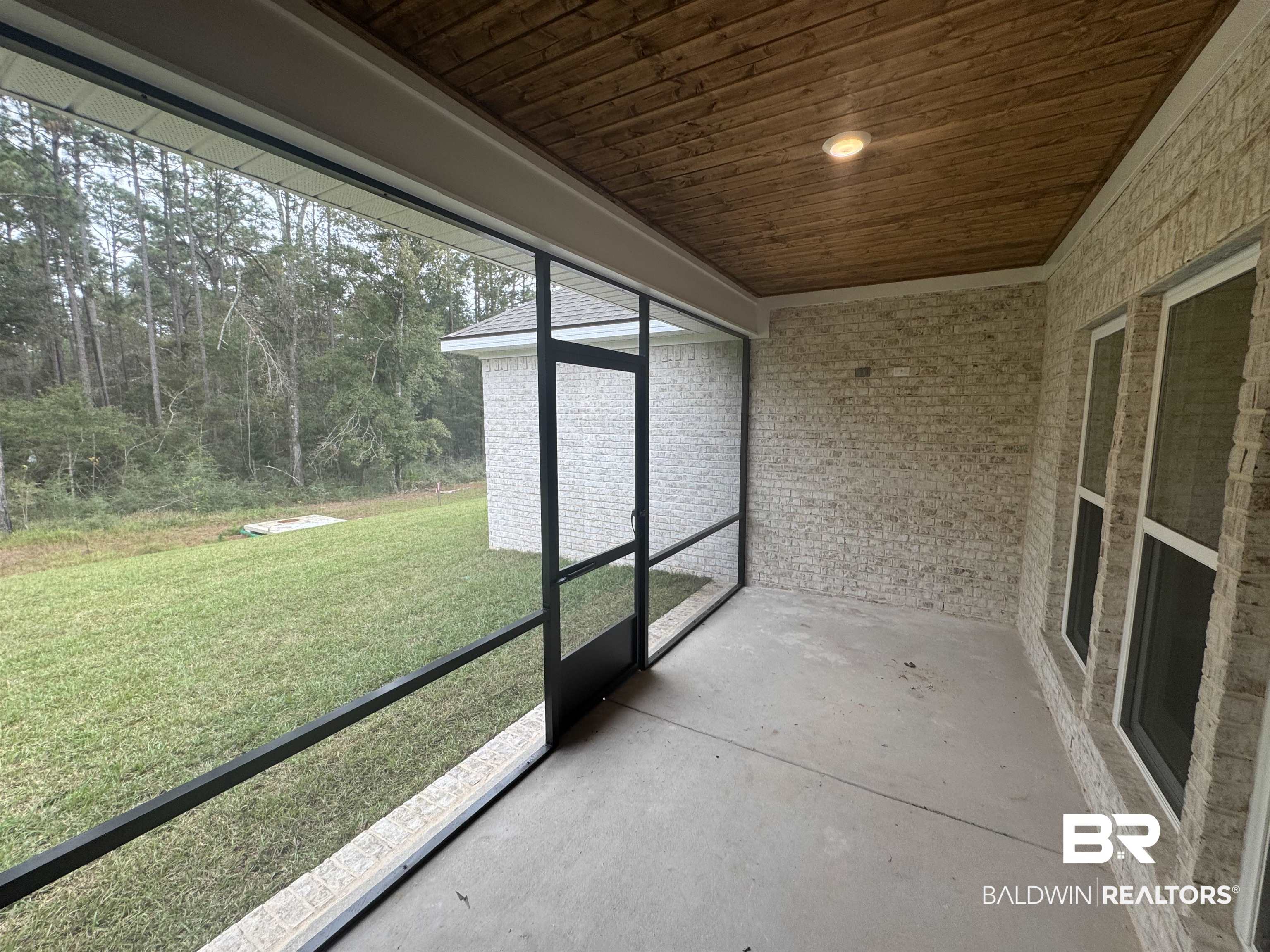 8090 Calverton Street, Unit 23 Foley, AL 36535 - Photo 15 of 30 Unfurnished sunroom with wooden ceiling