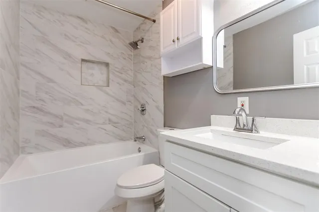 a view of a room with wooden floor chandelier and a window