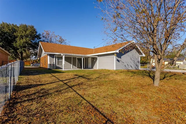 a view of swimming pool with seating yard and trees