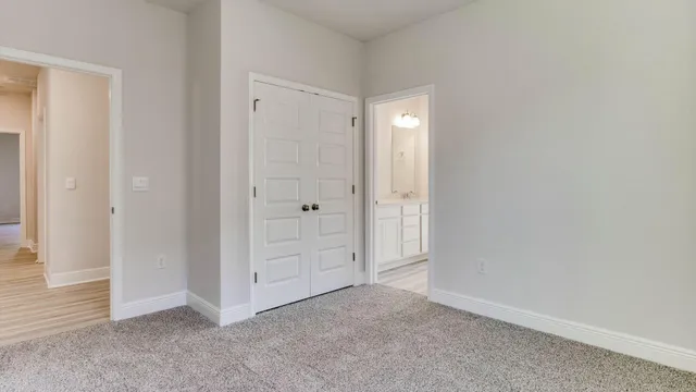 an empty room with closet area