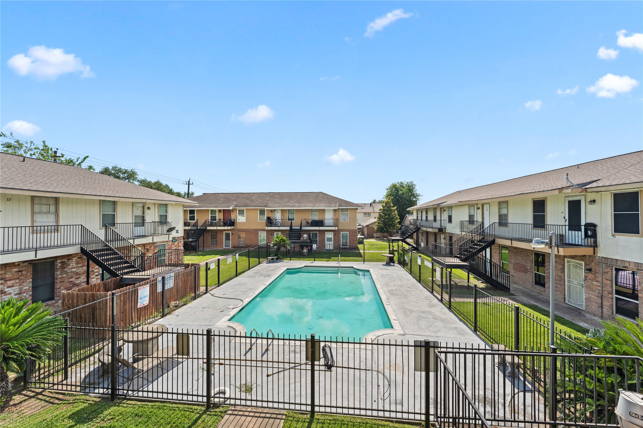 3316 Burke Road, Unit 43 Pasadena, TX 77504 - Photo 14 of 15 a front view of a house with swimming pool