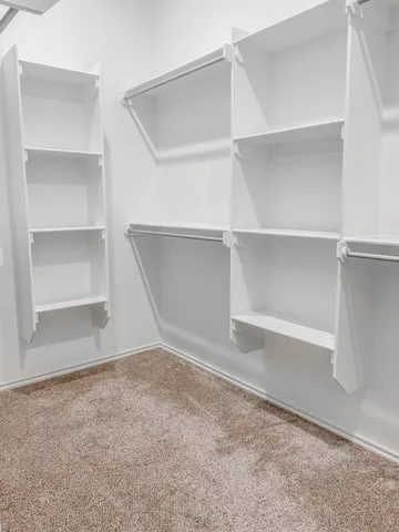 a view of an empty room with a closet