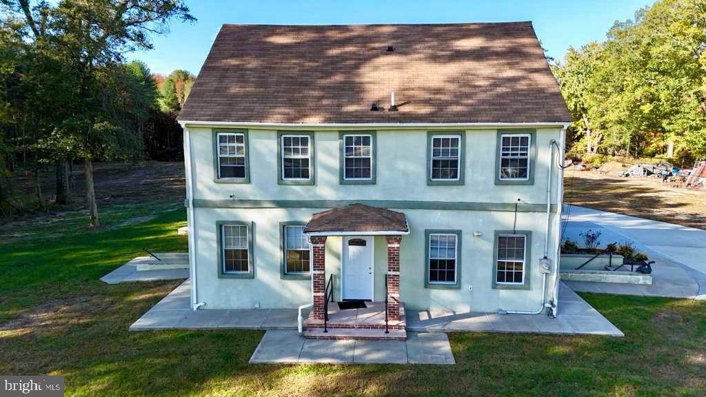 141 Arneys Mt Road Pemberton, NJ 08068 - Photo 1 of 20 a front view of a house with a yard