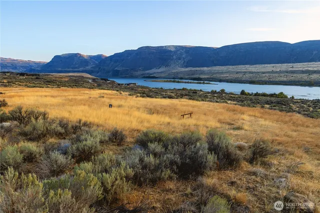 a view of an ocean and a mountain