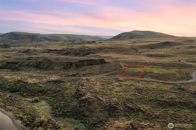 a view of a town with mountains in the background