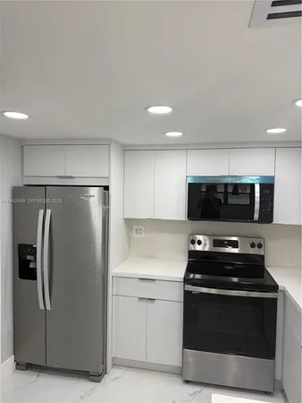 a kitchen with a stove and a sink