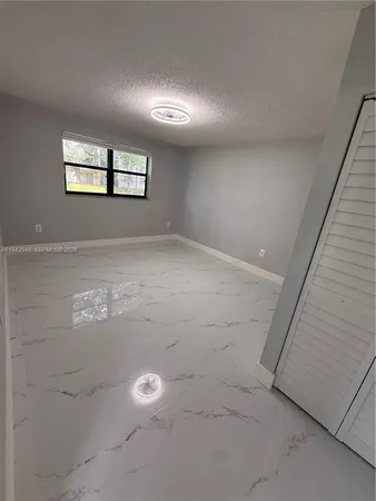 a bathroom with a toilet and a bathtub