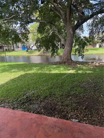 a view of a swimming pool with a lounge chairs