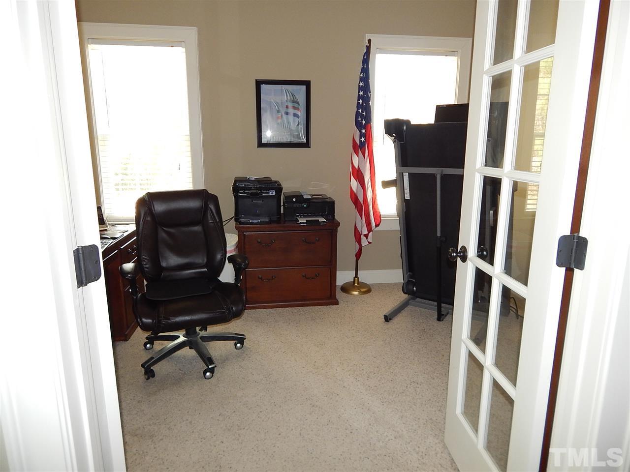 32 North Sunset Ridge Drive Willow Spring, NC 27592 - Photo 11 of 25 a view of a workspace with furniture and a window