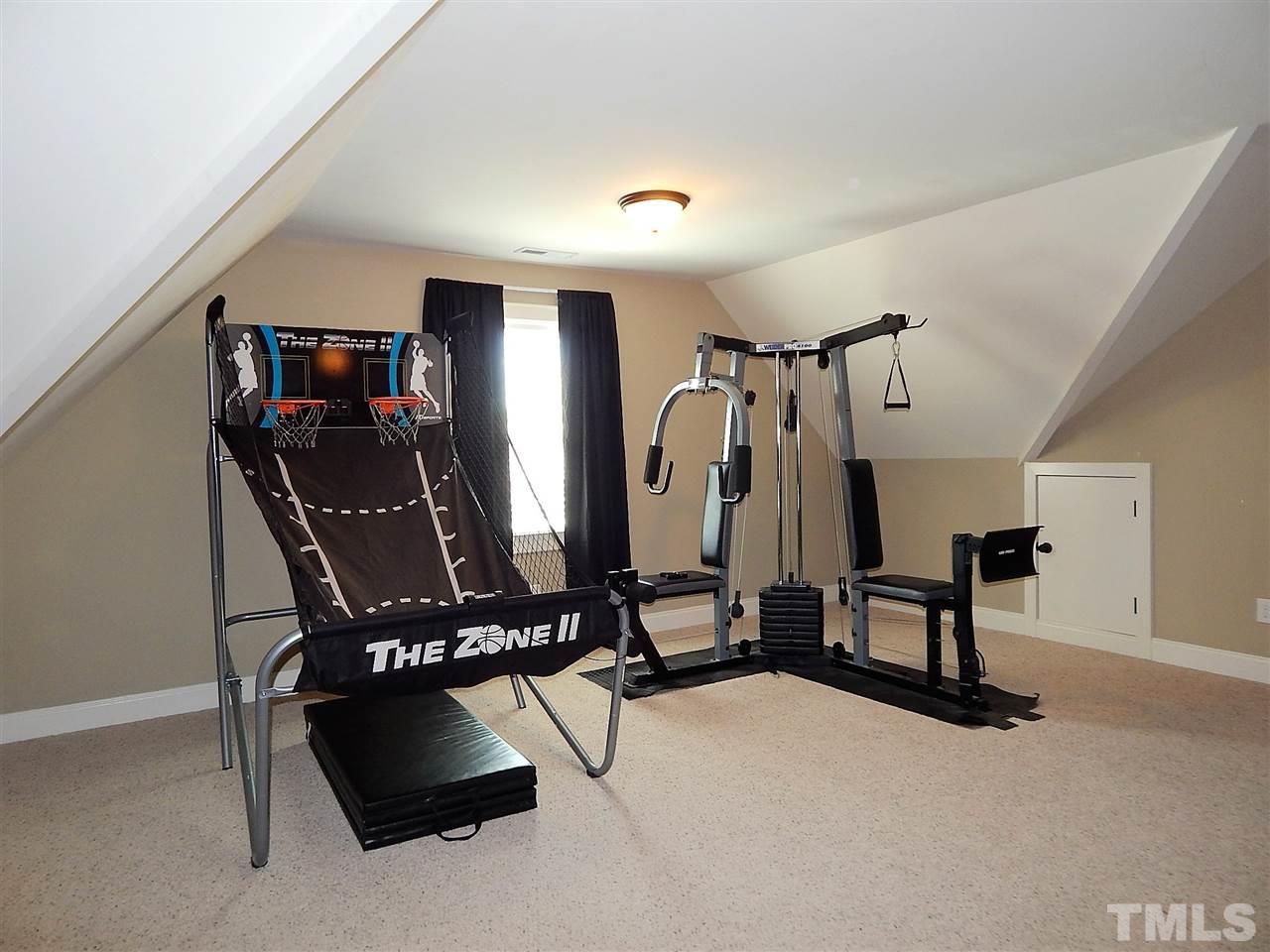 32 North Sunset Ridge Drive Willow Spring, NC 27592 - Photo 19 of 25 a view of gym equipment and windows