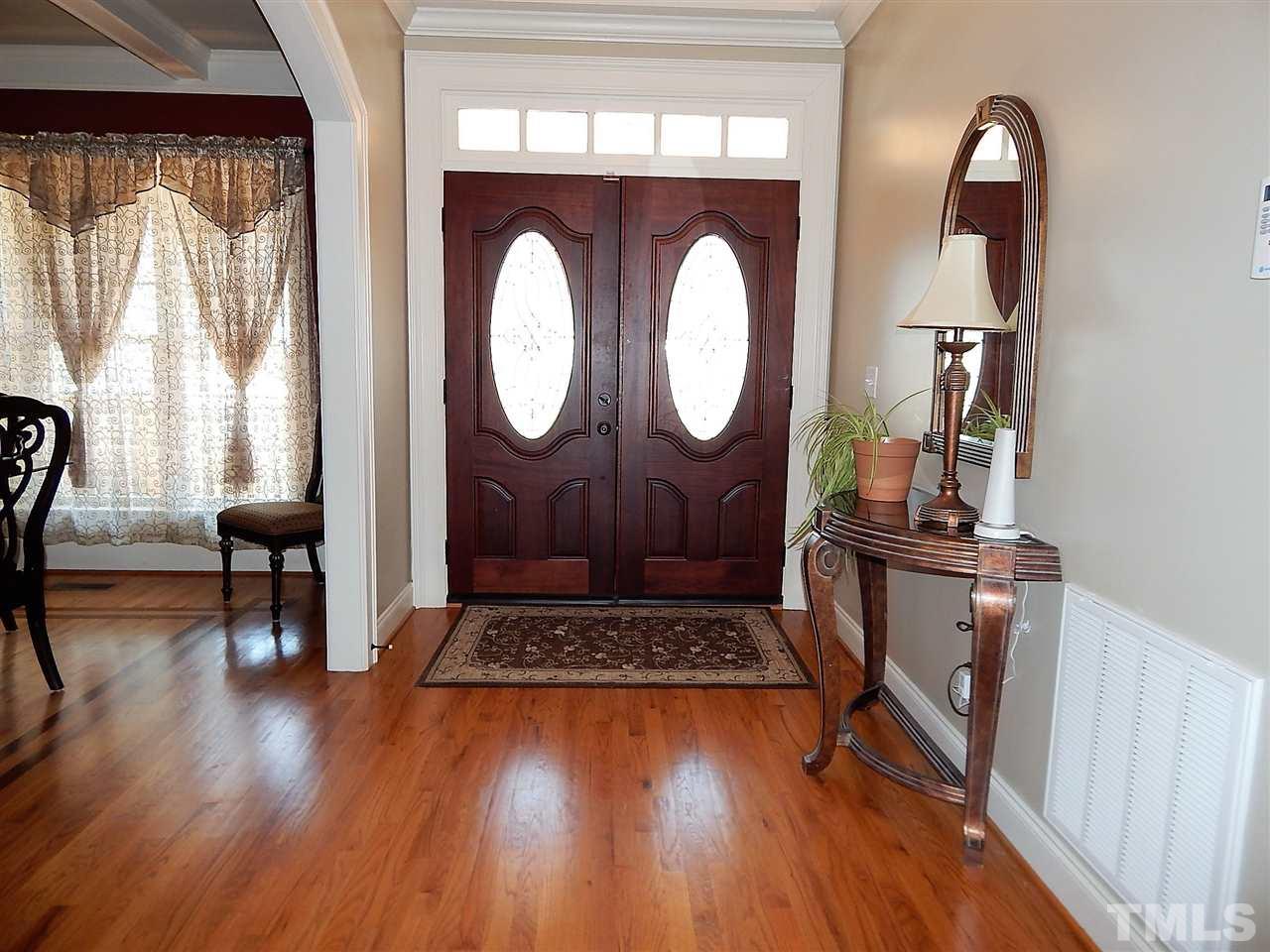 32 North Sunset Ridge Drive Willow Spring, NC 27592 - Photo 3 of 25 a living room with furniture and a wooden floor