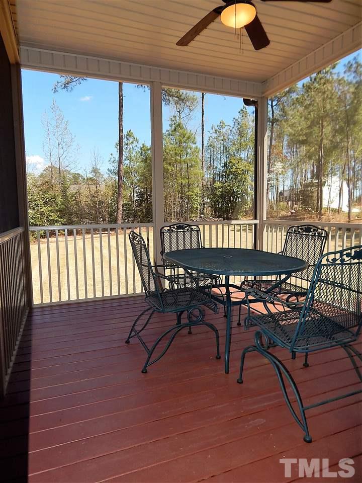 32 North Sunset Ridge Drive Willow Spring, NC 27592 - Photo 22 of 25 a view of a chairs and table in patio