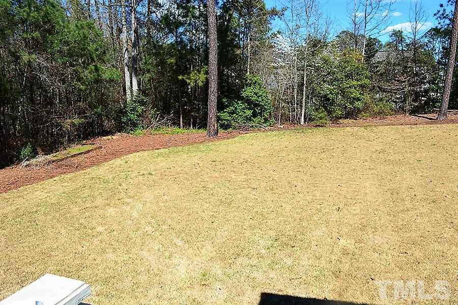32 North Sunset Ridge Drive Willow Spring, NC 27592 - Photo 24 of 25 a view of a yard with trees