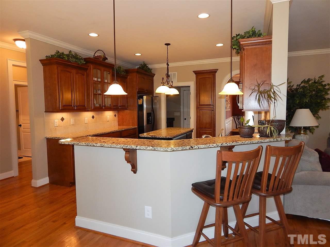 32 North Sunset Ridge Drive Willow Spring, NC 27592 - Photo 6 of 25 a kitchen with lots of counter space and appliances