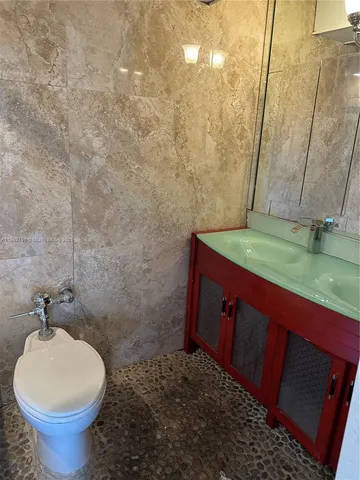 a bathroom with a sink and a toilet