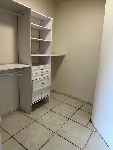 a view of an empty walk in closet