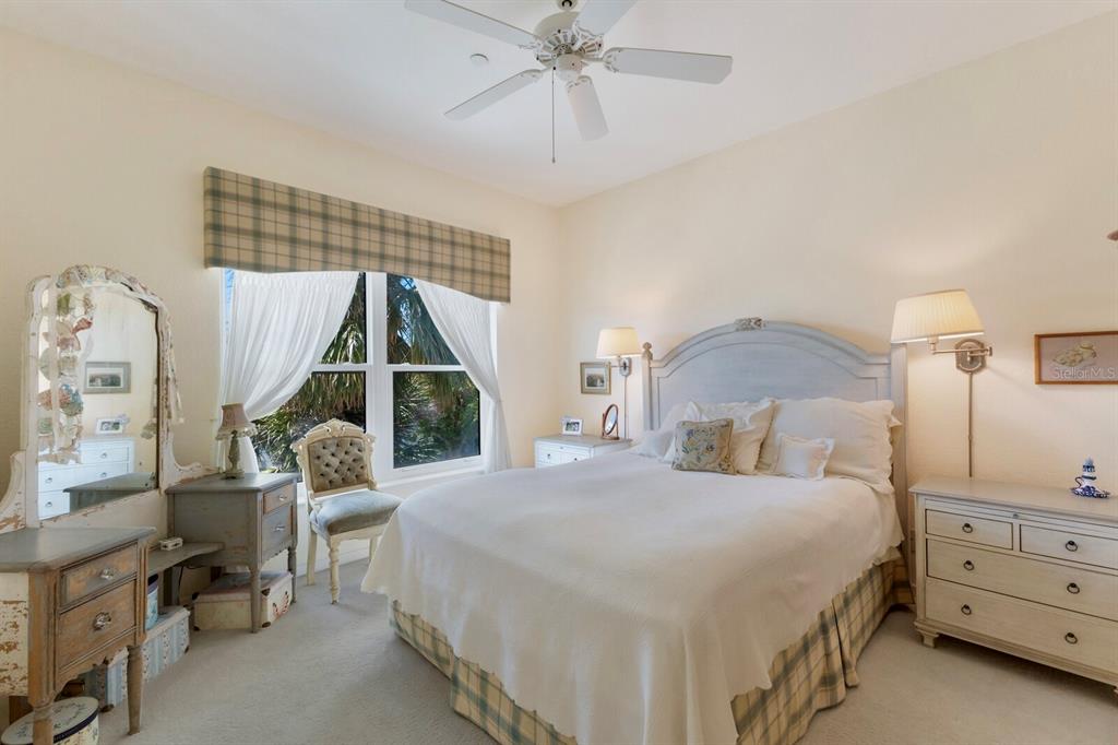815 South Harbor Drive Boca Grande, FL 33921 - Photo 14 of 74 a bedroom with a bed and a chandelier