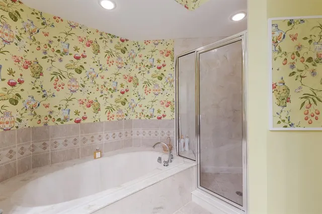 a view of a patio with table and chairs potted plants