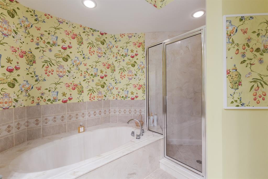 815 South Harbor Drive Boca Grande, FL 33921 - Photo 19 of 74 a bathroom with a bathtub and shower