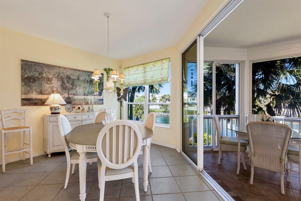 815 South Harbor Drive Boca Grande, FL 33921 - Photo 6 of 74 a dining room with furniture a chandelier and window