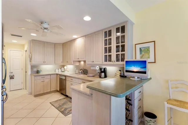 a view of a dining room with furniture and a window