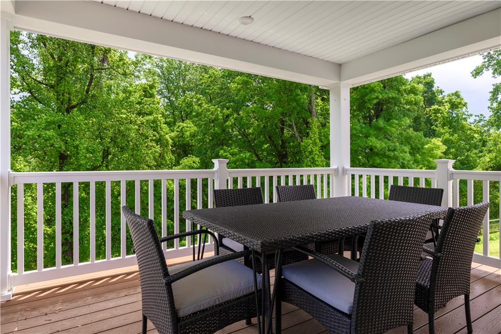 844 Ashley Road Gibsonia, PA 15044 - Photo 1 of 16 a view of a dining table and chairs on the roof deck