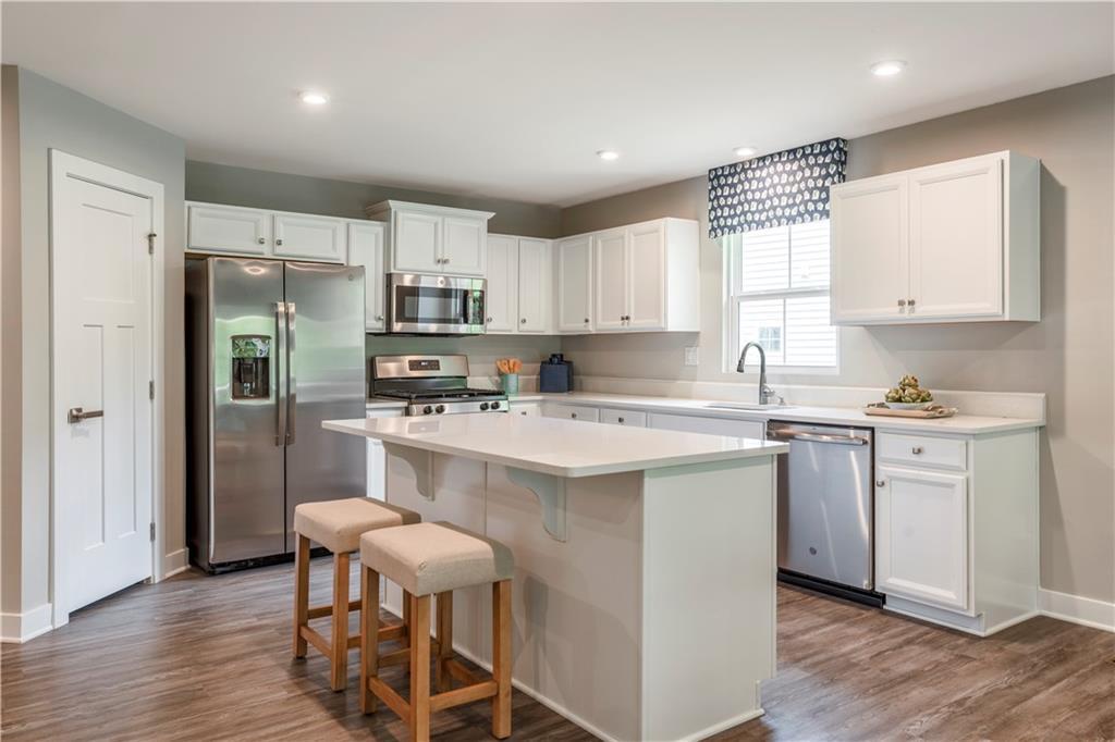 844 Ashley Road Gibsonia, PA 15044 - Photo 6 of 16 a kitchen with a stove a sink and a refrigerator