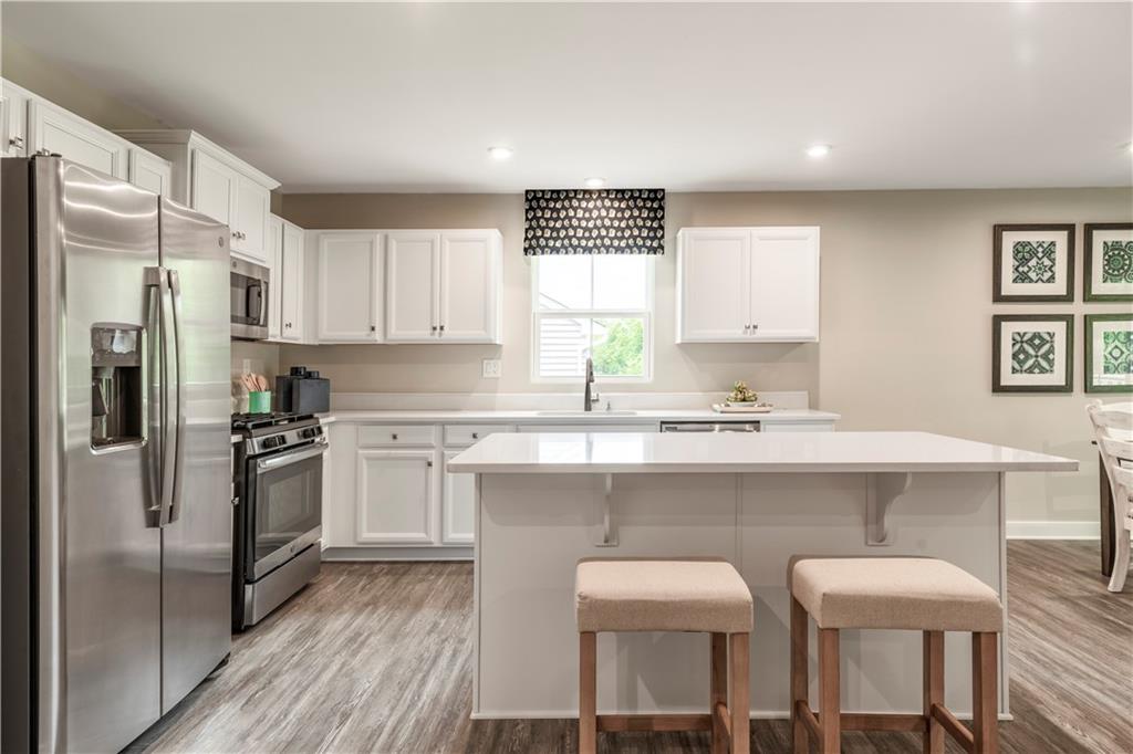 844 Ashley Road Gibsonia, PA 15044 - Photo 10 of 16 a kitchen with cabinets and chairs