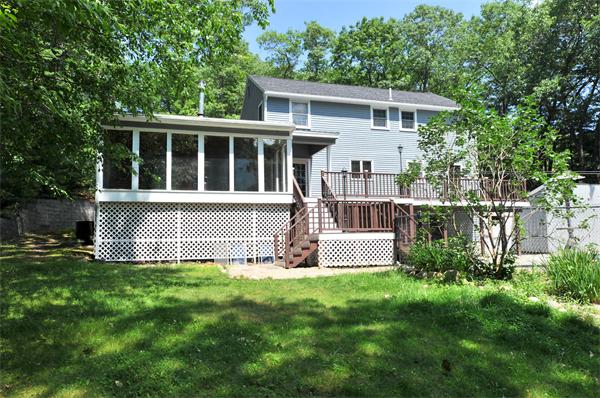 138 Rattlesnake Hill Road Andover, MA 01810 - Photo 13 of 17 a view of house with backyard and garden