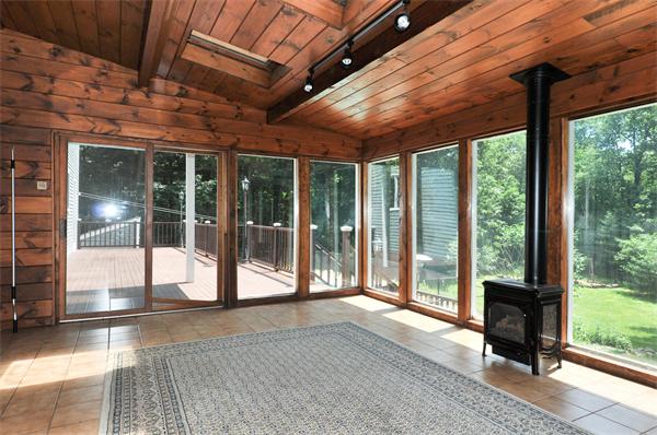 138 Rattlesnake Hill Road Andover, MA 01810 - Photo 6 of 17 a view of a porch with wooden floor and outside view