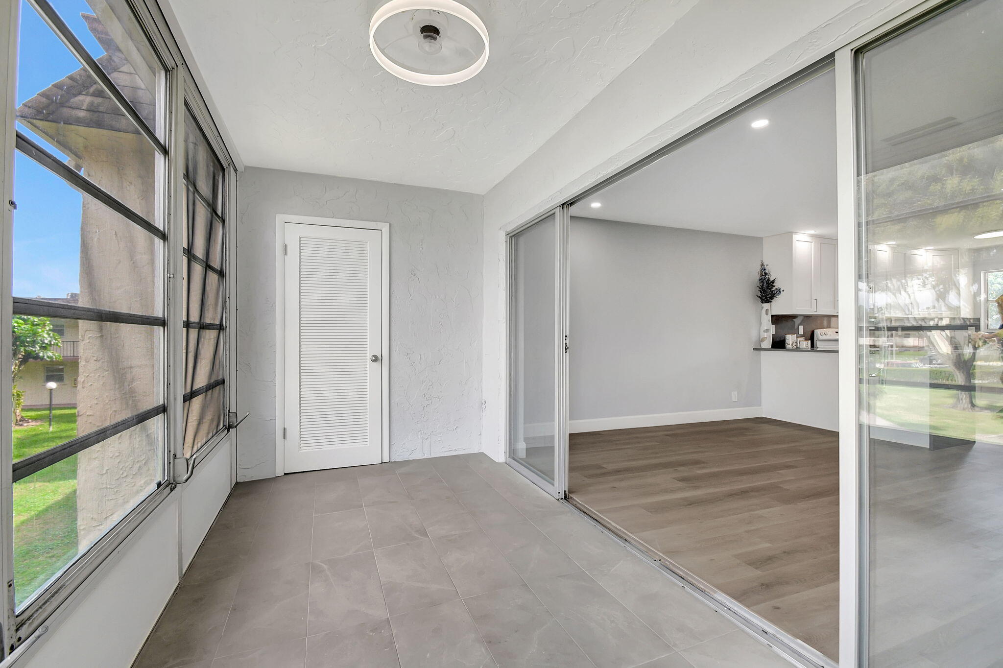 702 Lori Drive, Unit 194 Palm Springs, FL 33461 - Photo 12 of 41 a view of empty room with wooden floor