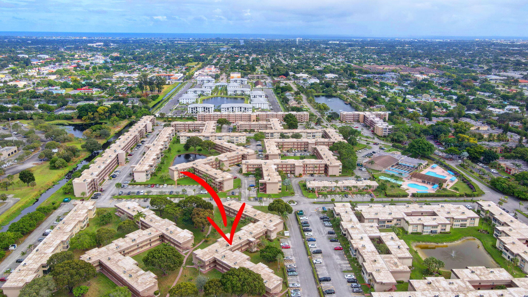 702 Lori Drive, Unit 194 Palm Springs, FL 33461 - Photo 33 of 41 an aerial view of residential houses with outdoor space