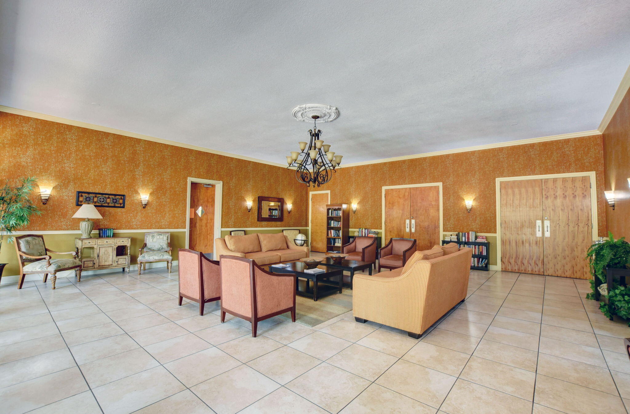 702 Lori Drive, Unit 194 Palm Springs, FL 33461 - Photo 36 of 41 a living room with furniture and a chandelier