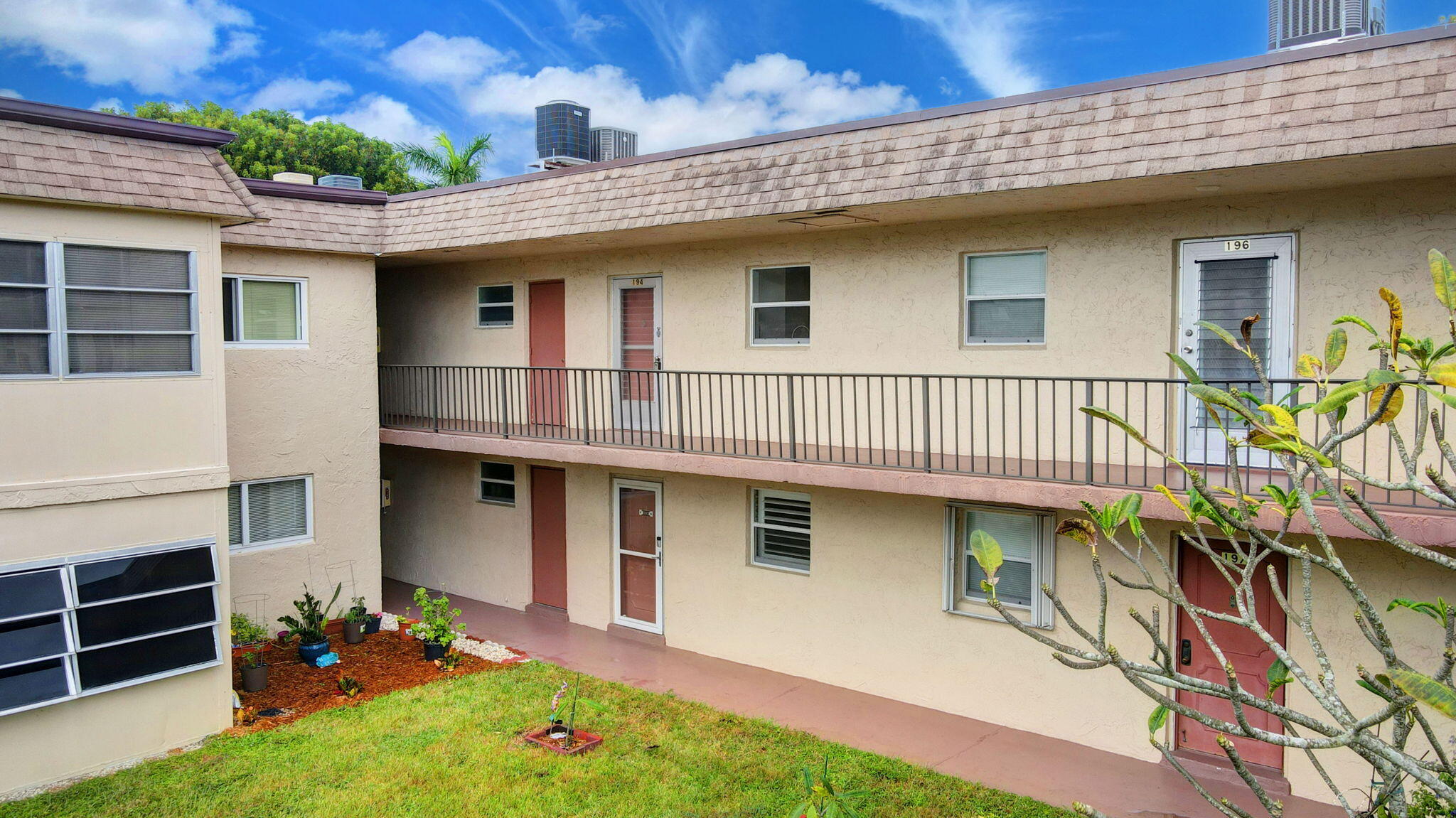 702 Lori Drive, Unit 194 Palm Springs, FL 33461 - Photo 39 of 41 front view of a house with a yard
