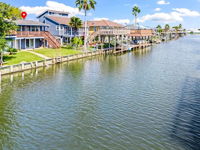 a view of a lake with a house in the background
