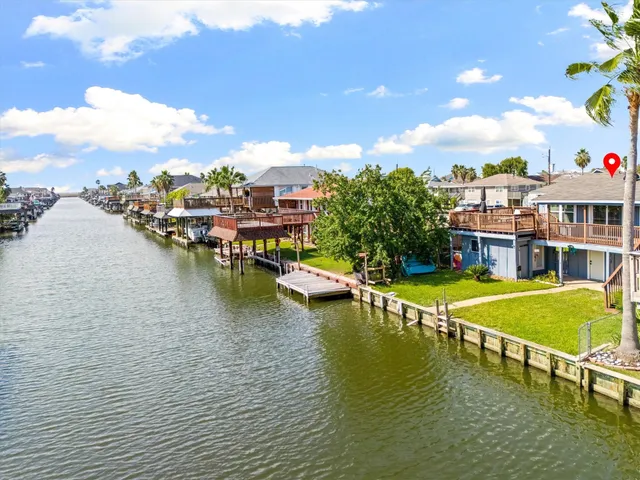 an aerial view of residential houses with outdoor space