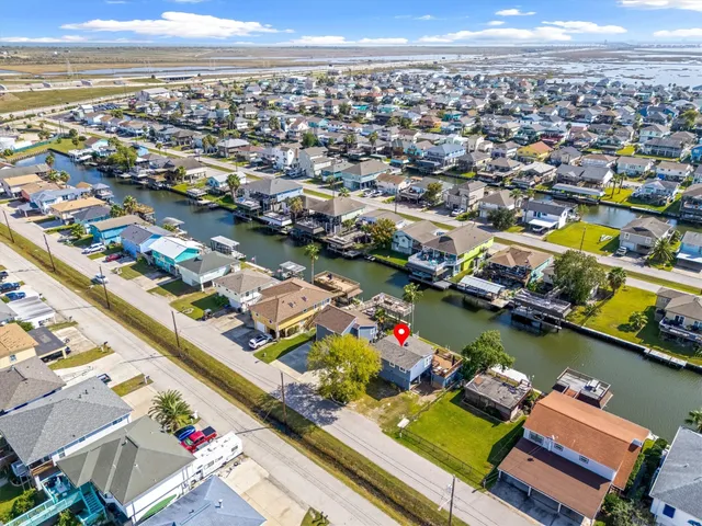 an aerial view of a city with lots of boats