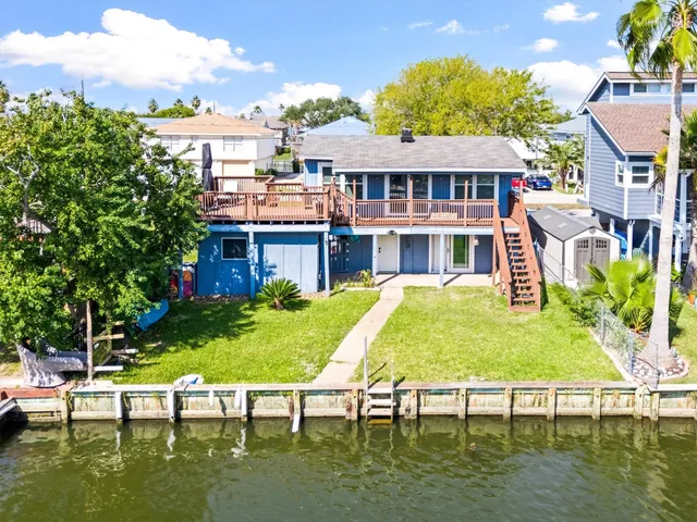 a view of a chair and table on the patio
