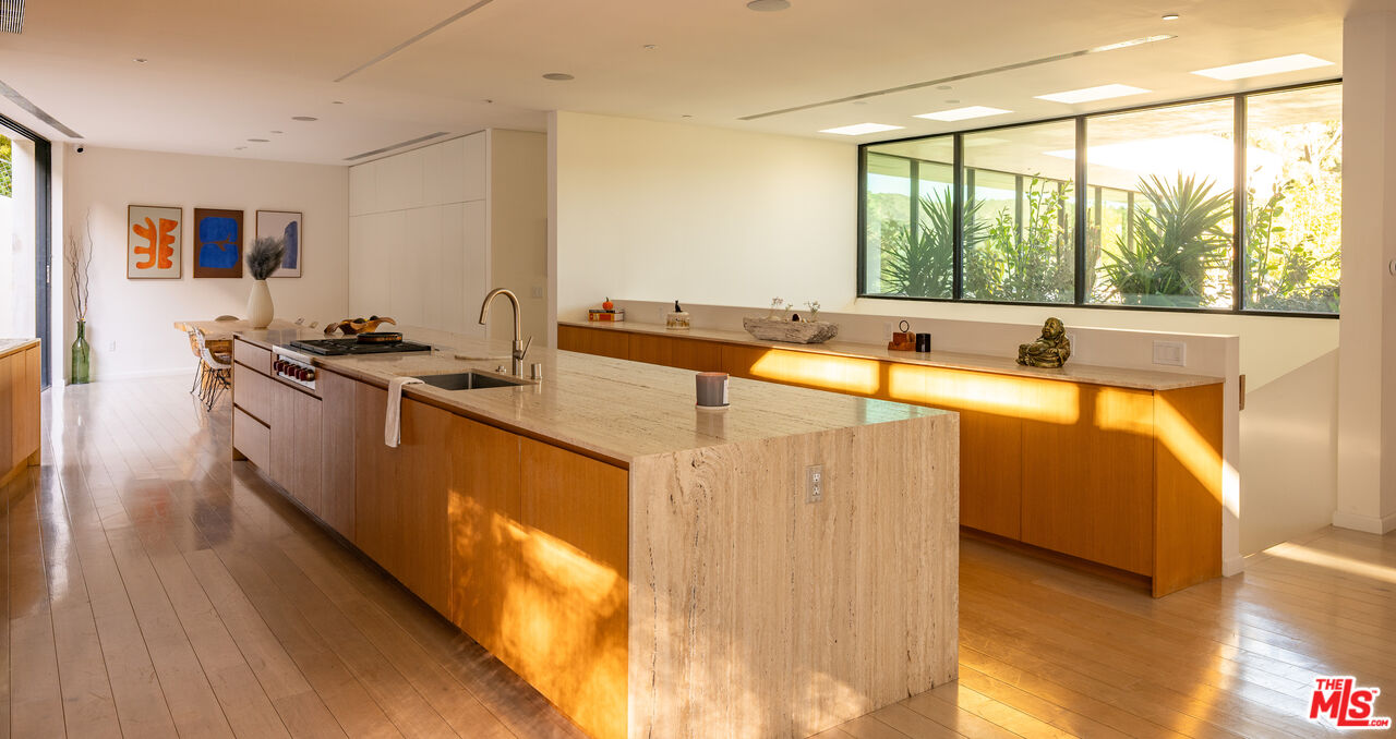 7681 Willow Glen Road Los Angeles, CA 90046 - Photo 16 of 71 a kitchen with stainless steel appliances granite countertop a sink and a stove