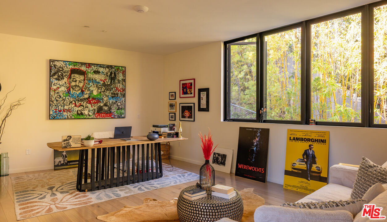 7681 Willow Glen Road Los Angeles, CA 90046 - Photo 44 of 71 a living room with furniture and a large window
